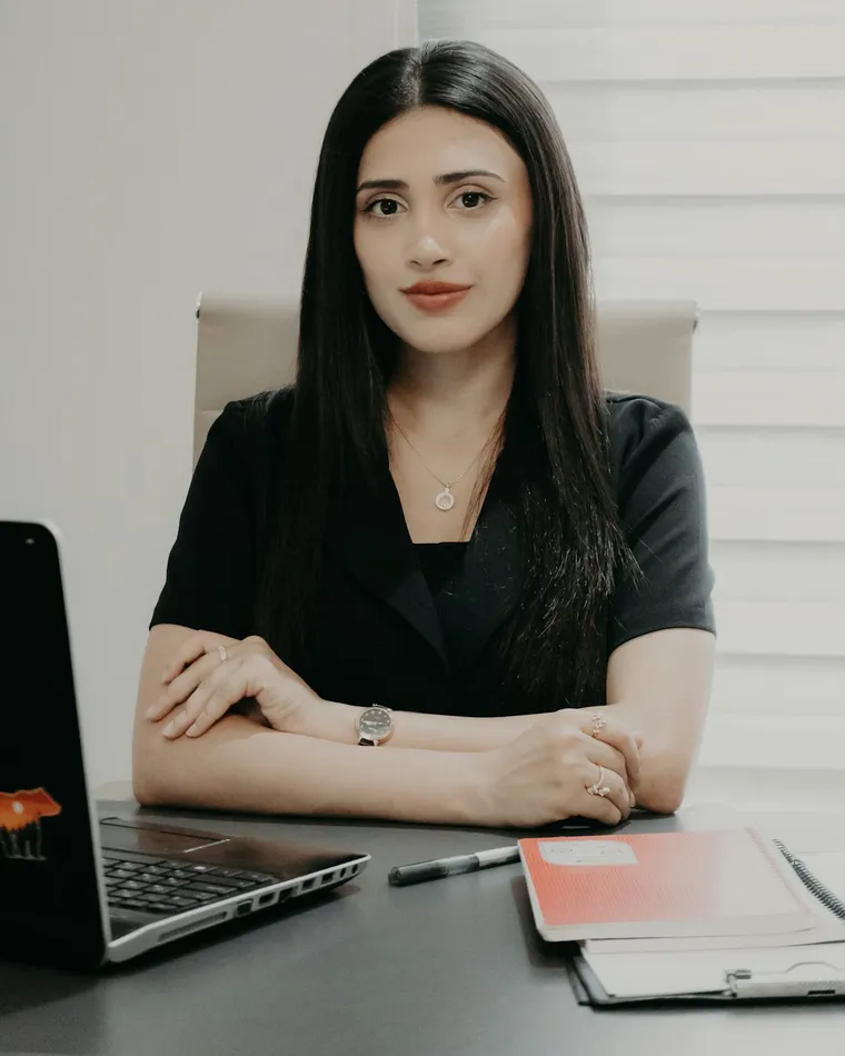 A team member at her desk